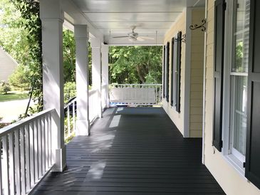 Freshly stained front porch a painting service in Wilmington