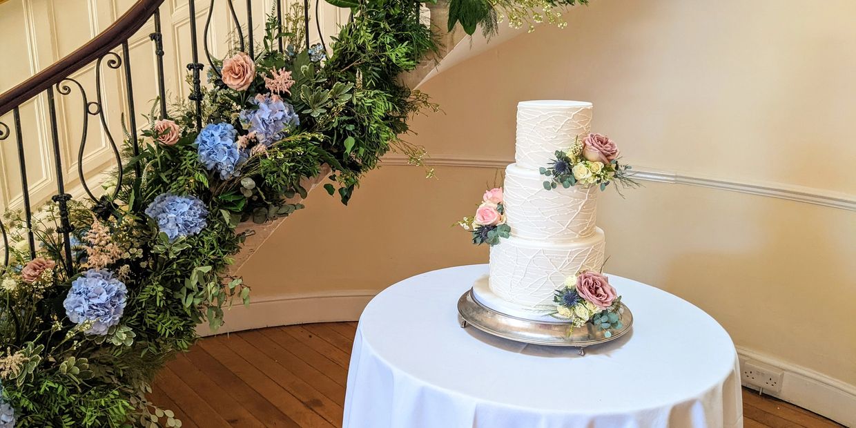 Traditional white wedding cake at Eastington Park 