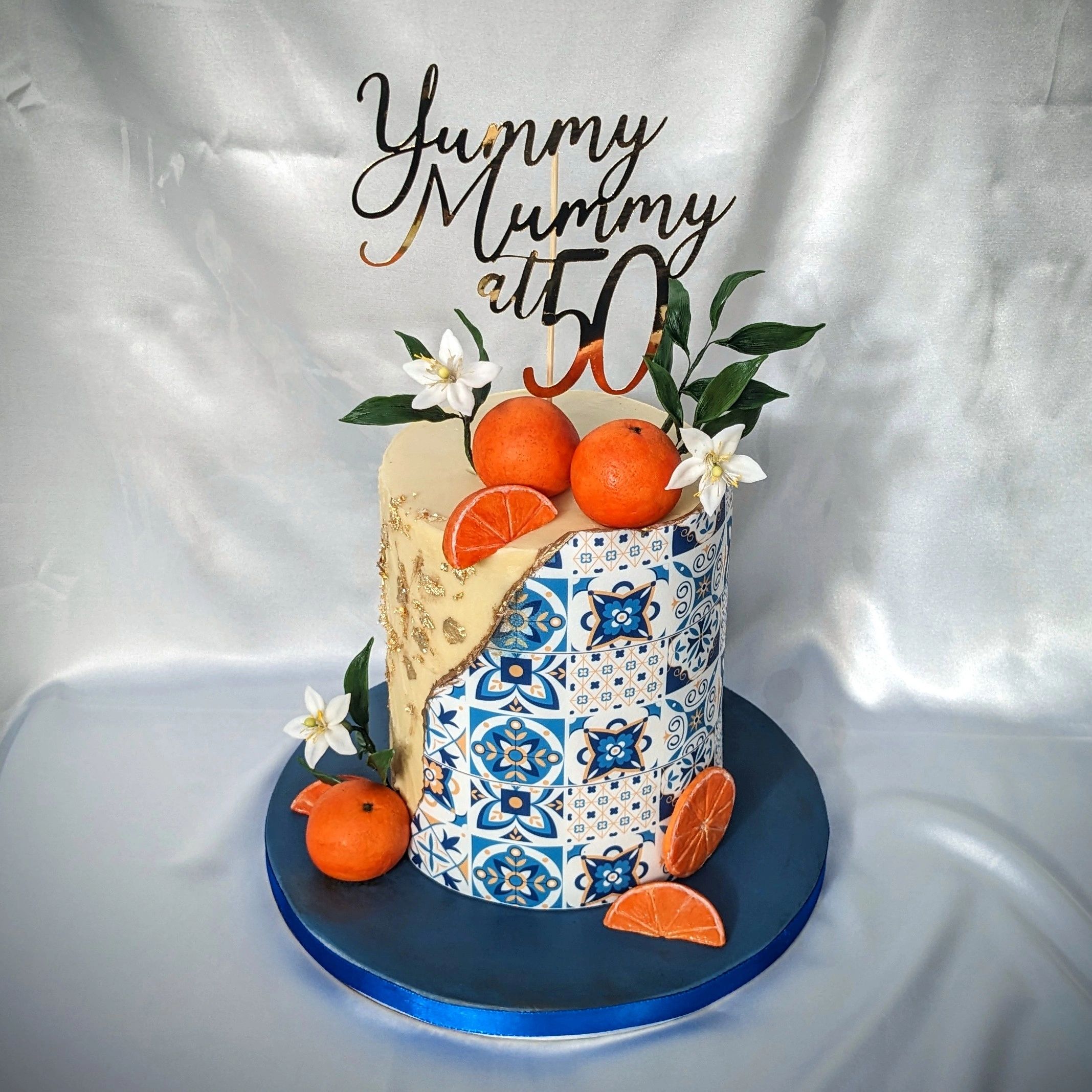 Yummy mummy 50th birthday cake with oranges, and Spanish vibes