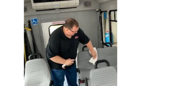 Driver cleaning bus