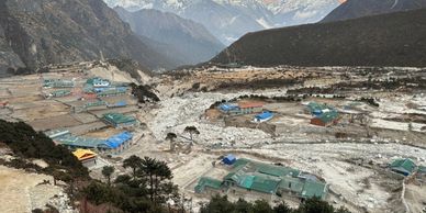 Climate Resilience and Disaster Preparedness: image of a village washed away by flash floods