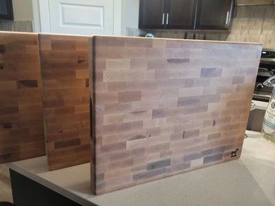 Set of wooden cutting boards on a kitchen counter.