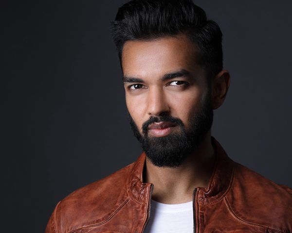 headshot of male model in leather jacket