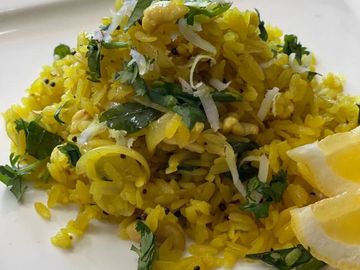 One of the healthy, wholesome & popular breakfast from Mumbai made with rice flakes , chillies, curr