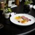 Dish of Striploin AAA steak with polenta tots, pickled and fermented surplus vegetables