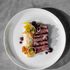 Dish of striploin AAA steak with polenta tots, pickled and fermented surplus vegetables