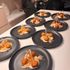 Dishes of mochi balls on banana jackfruit custard, caramel, shortbread crumb