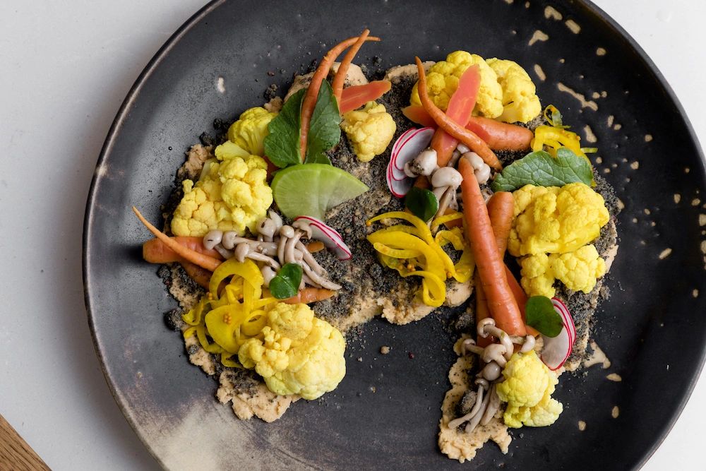 A dish featuring surplus marinated, pickled and fresh seasonal vegetables