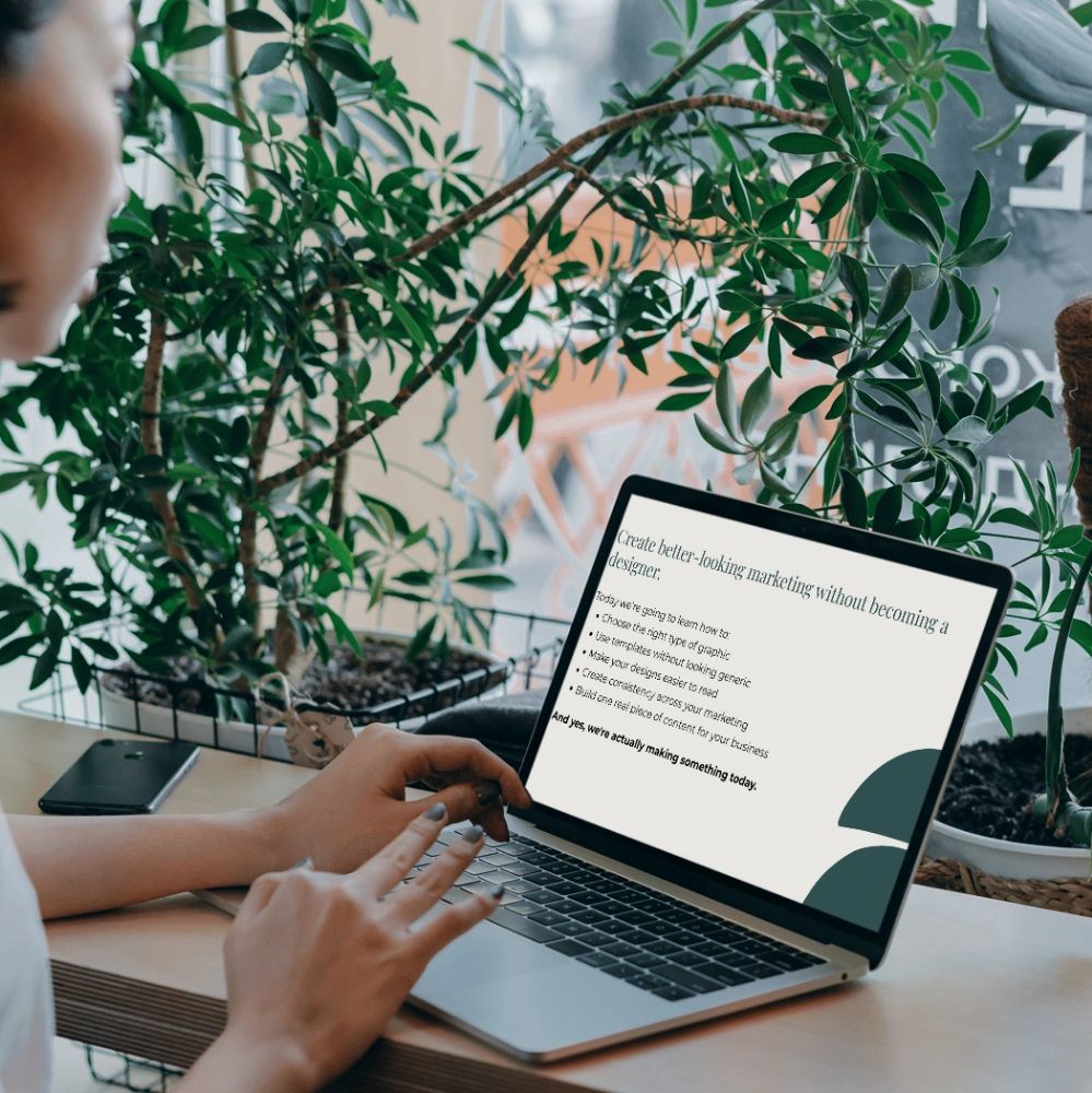 Person working on marketing design tips on a laptop.
