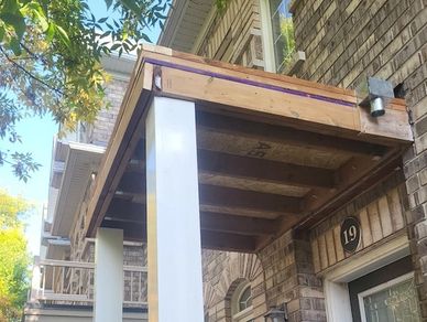 Newly framed porch roof installed onto new square fibreglass columns. Toronto GTA