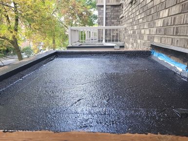 Flat roof waterproofing membrane applied to newly rebuilt porch roof. Toronto GTA