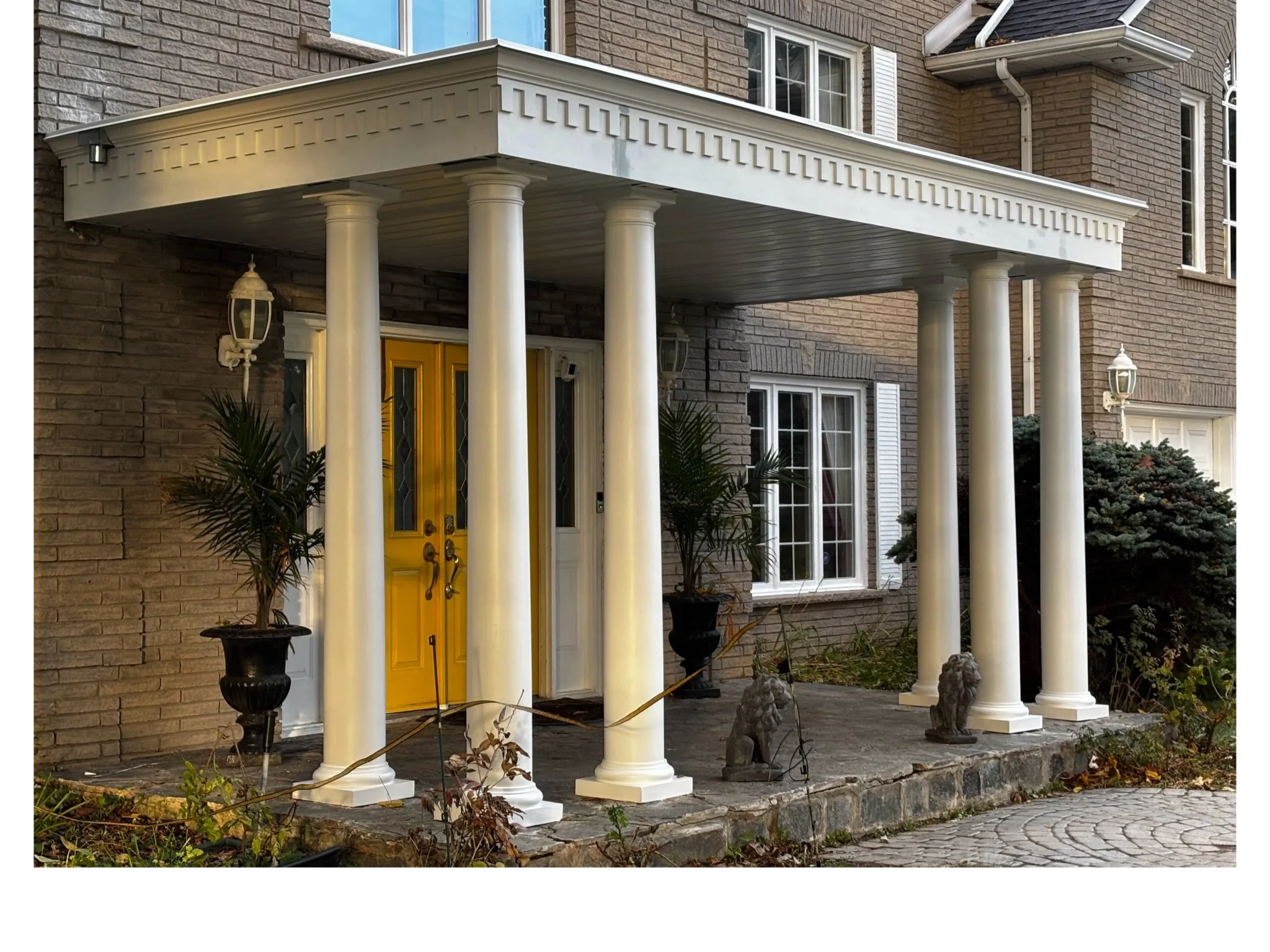Large Round Fibreglass Columns installed on Stone Porch 