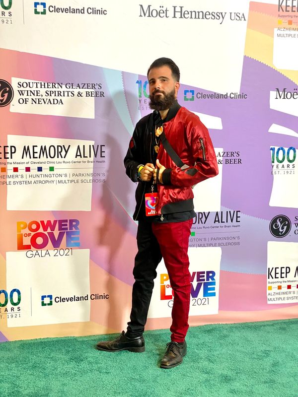 Solo picture of Niko Galvez dressed in red and black at an event