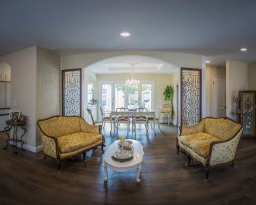 Elegant vintage living room with yellow upholstered sofas.