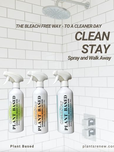 Plant-based cleaning spray bottles in a clean tiled shower area.