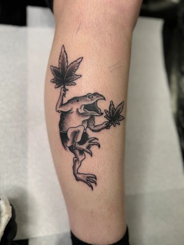 Black and grey traditional frog tattoo 