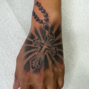 Black and grey rosary tattoo 