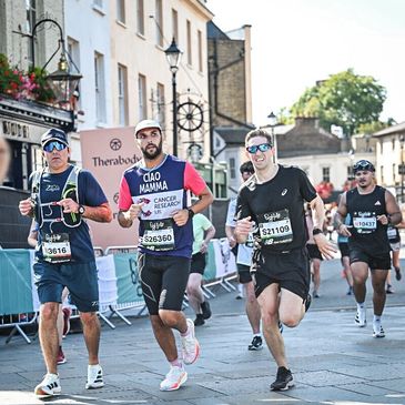 Runners participating in a city marathon on a sunny day.