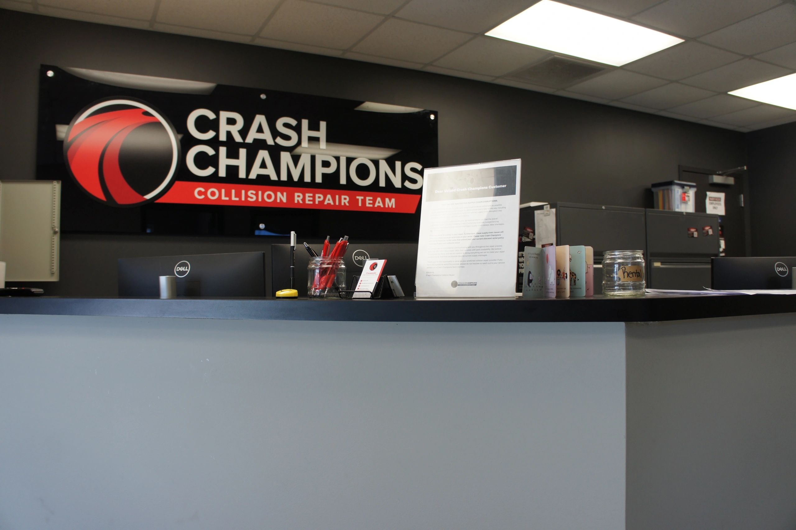 Reception desk at Crash Champions collision repair team office.