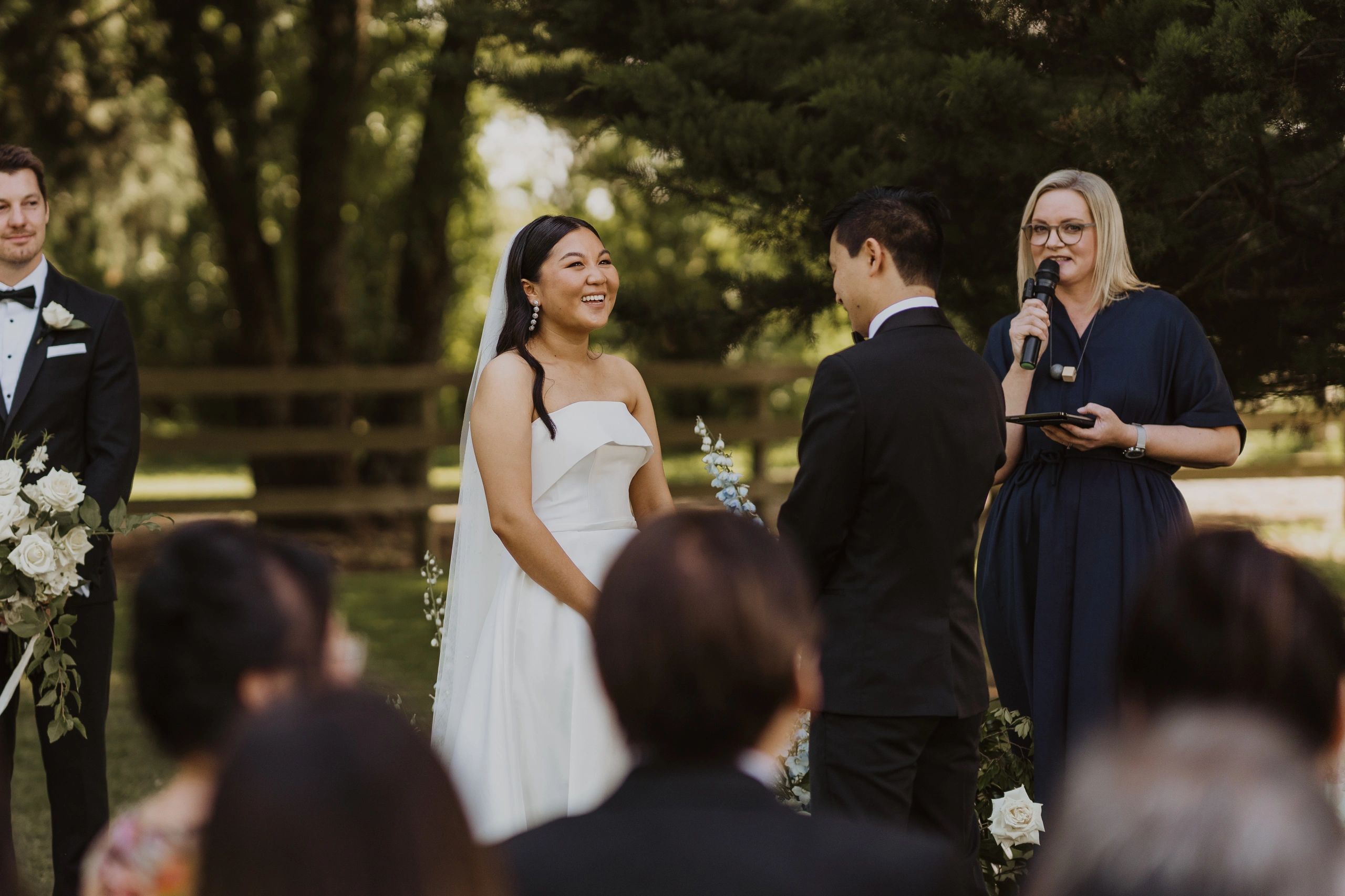 Bride and groom at their wedding ceremony with the celebrant