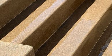 Custom concrete sand finish steps and patio.  Custom Davis Color.
