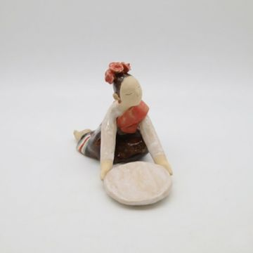 Figurine of a person with a plate.