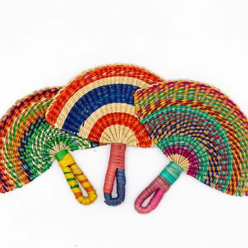 Three colorful woven hand fans arranged side by side.