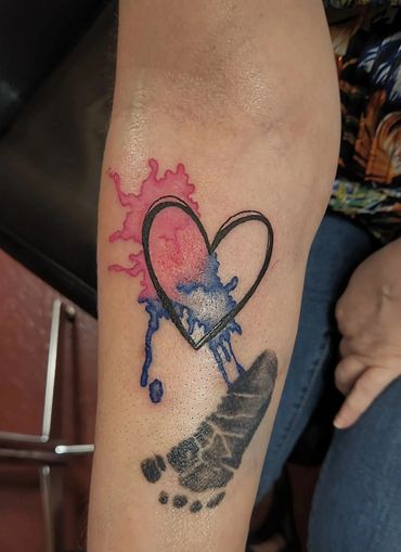 Heart with blue and pink watercolor splash.