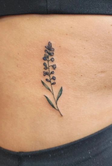 Minimalist lavender sprig tattoo.
