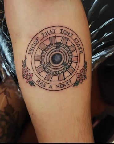 Circular "Iron Man" arc reactor tattoo.