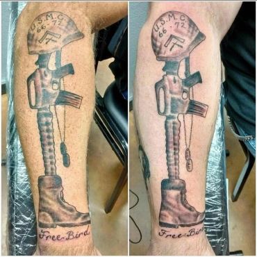 Soldier memorial cross tattoo.