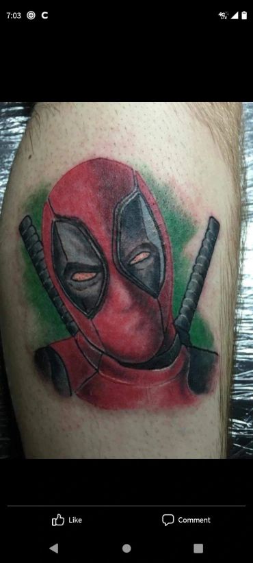 Deadpool character portrait tattoo.