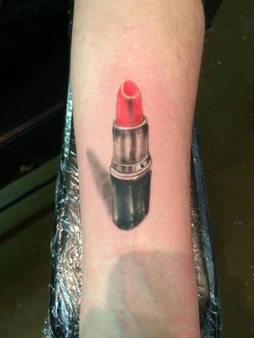 Realistic red lipstick tattoo.