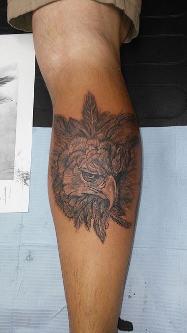 Detailed circular mandala forearm tattoo.