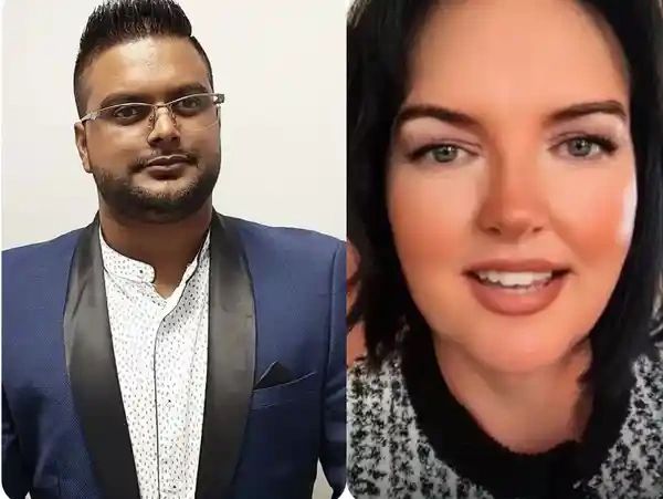 A man in a suit and a woman speaking.
