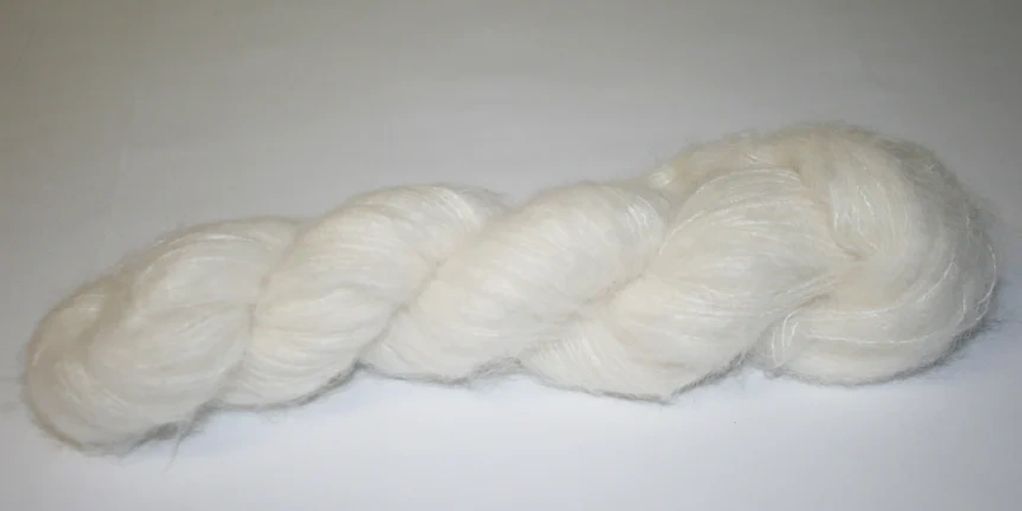 2 ply brushed alpaca with merino. Shown in 50gm skein