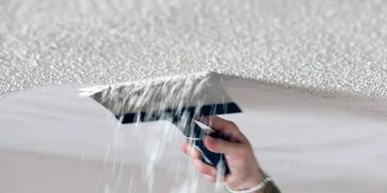 Scraping old pop corn off of ceiling