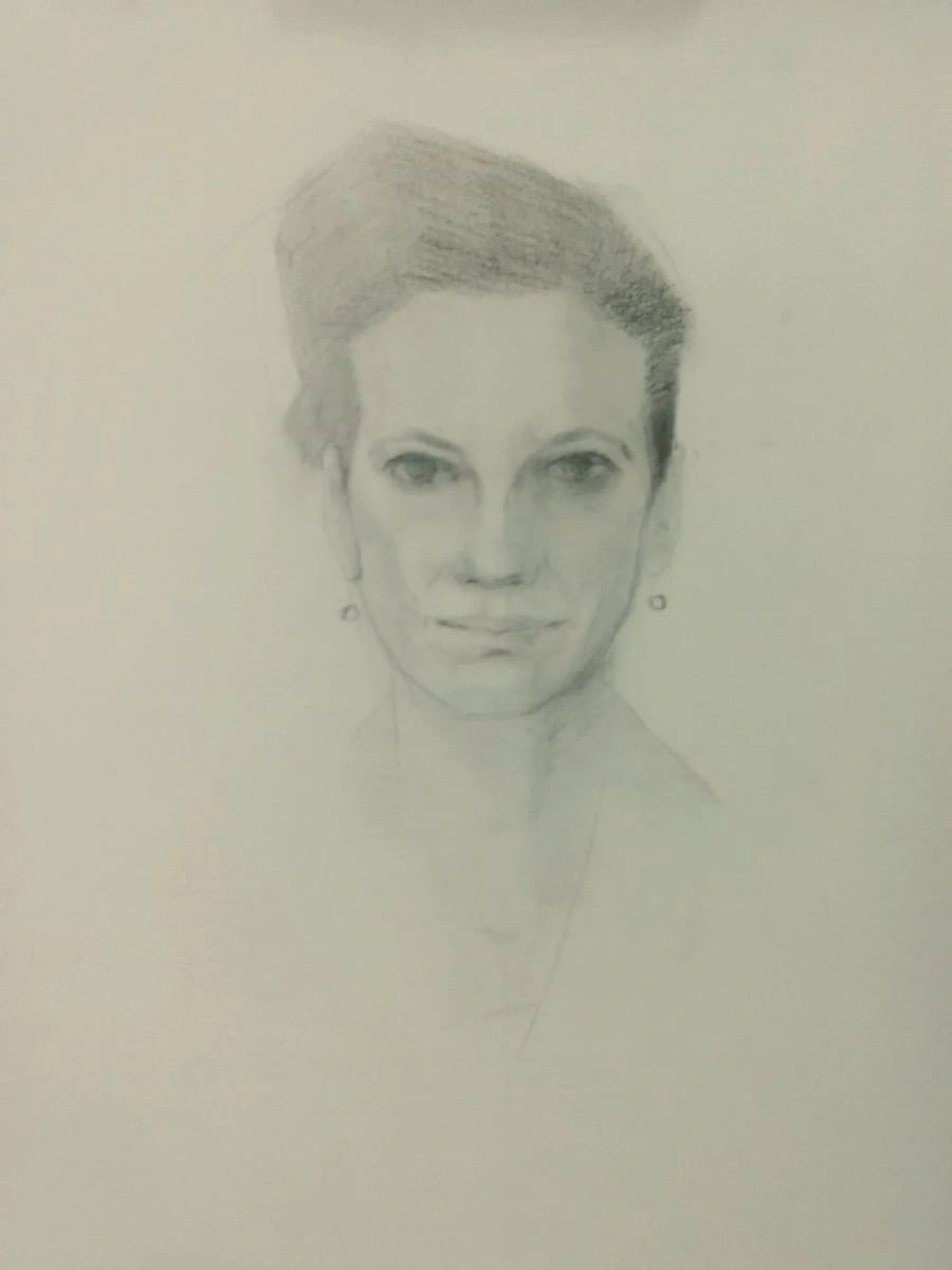 Portrait of a woman, head and shoulders, in charcoal on paper.  By Curtis Green