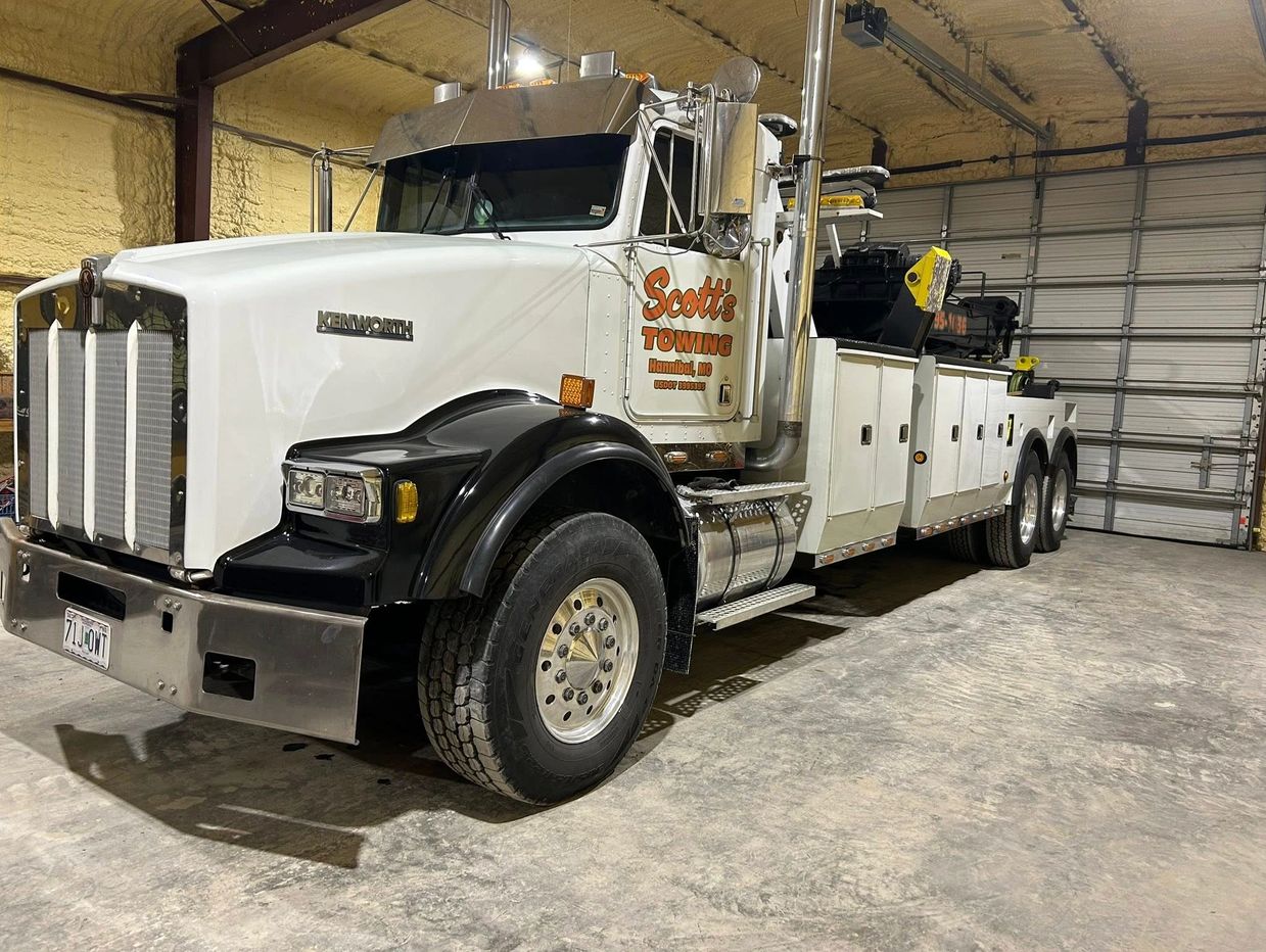 Scott’s Towing heavy-duty wrecker in Hannibal, MO shop, ready for semi recovery and towing.
