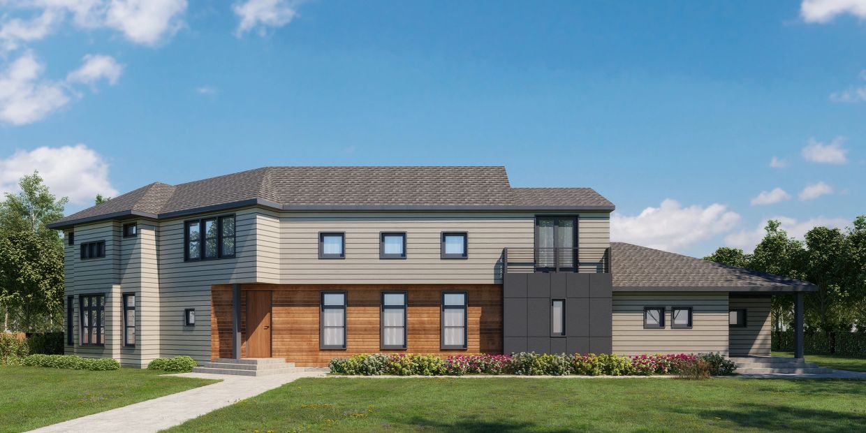 Modern two-story house with mixed siding and large windows under a clear blue sky.
