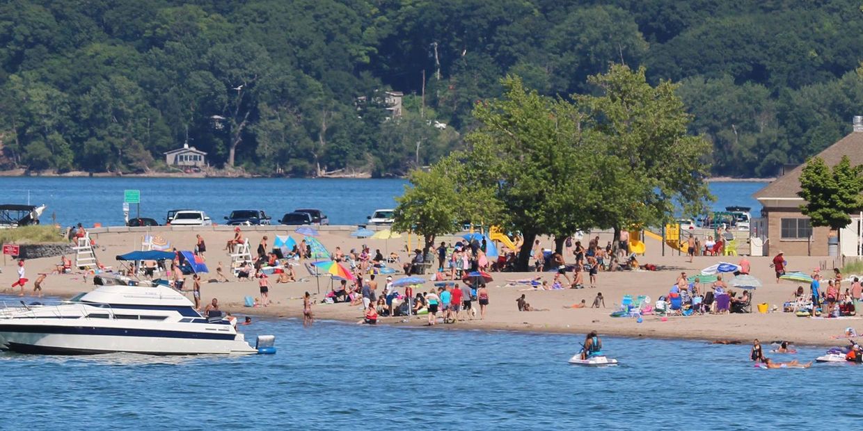 People on the beach in sodus bay