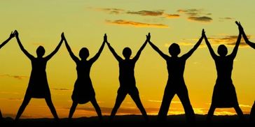 Group of people linking hands