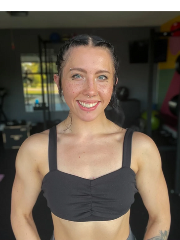 Close up shot of a girl wearing a black color sports bra