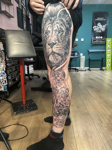 Detailed lion tattoo covering the leg.
Cover Up Tattoos Wigan
Tattoo Cover Up Wigan
Black and Grey 
