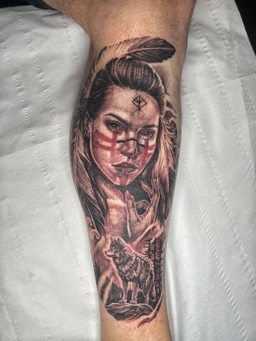 Realistic tattoo of a woman with a wolf and tribal markings.Cover Up Tattoos Wigan
Tattoo Cover Up