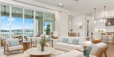 Bright living room with ocean view and modern decor.