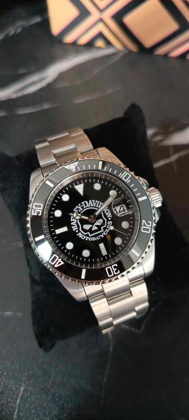 Harley-Davidson wristwatch with a black dial and stainless steel band.