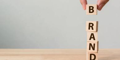 Building blocks with individual letters spelling the word brand