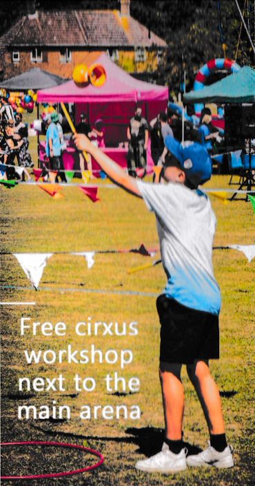 Boy practicing diabolo at an outdoor circus workshop.