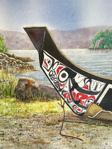 Haida Canoe resting on the shoreline with rainstorm approaching.